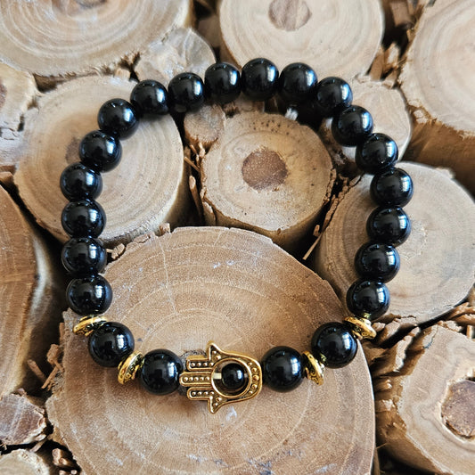 Schwarzes Perlenarmband mit Hand der Fatima Symbol in Gold